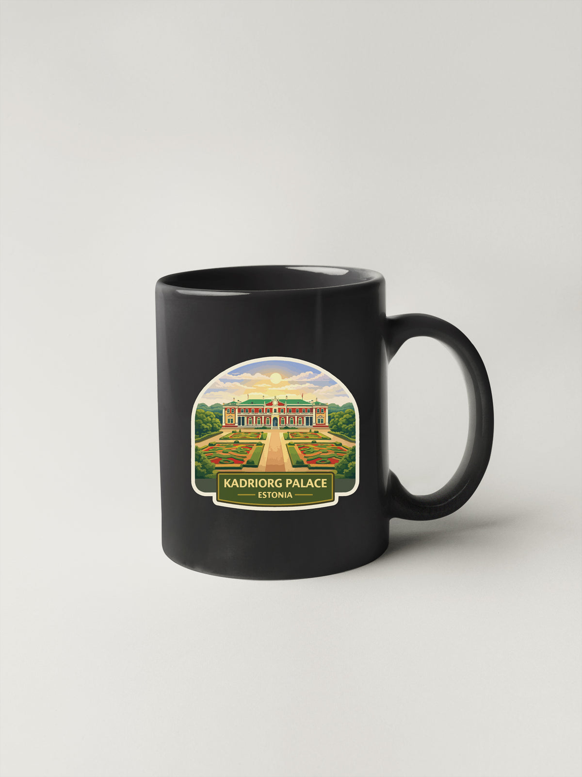 A black coffee mug with a sticker depicting the Kadriorg Palace in Estonia.