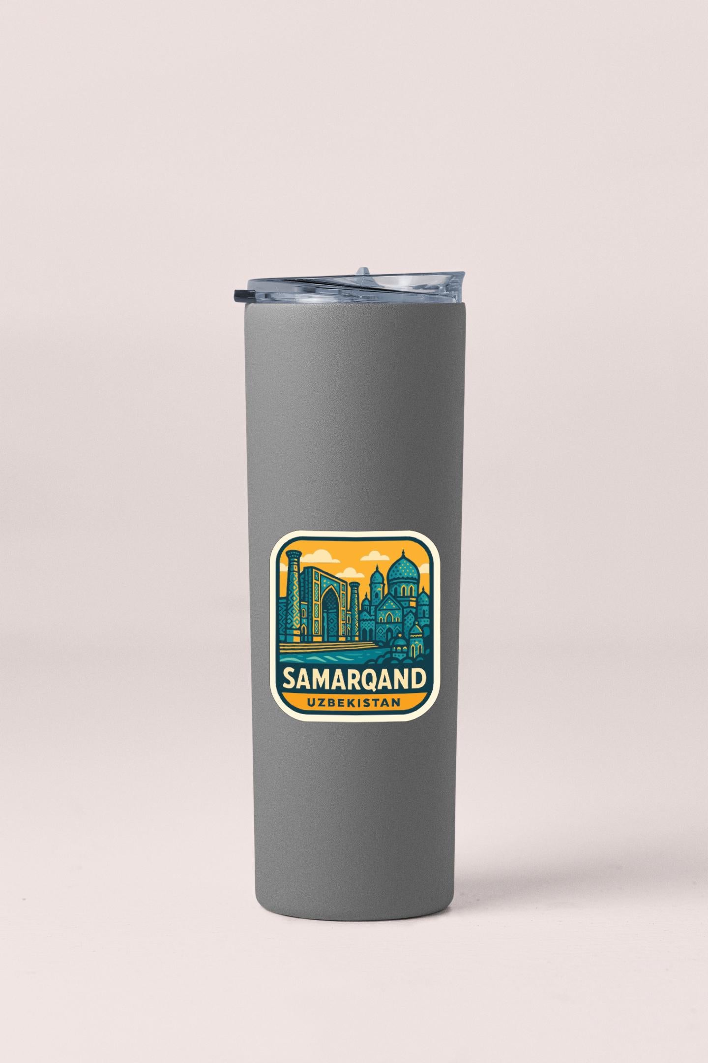 A gray insulated tumbler with a sticker depicting the city of Samarqand, Uzbekistan.