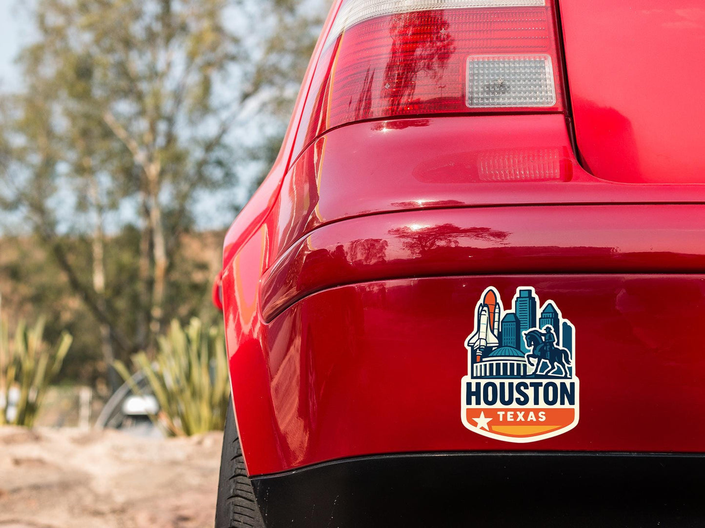 a close up of the tail end of a red car