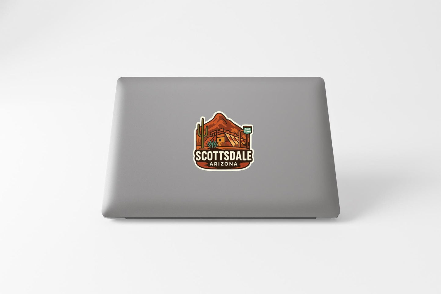 A sticker on the back of a laptop displaying the text "SCOTTSDALE ARIZONA" along with an illustration of a desert landscape.