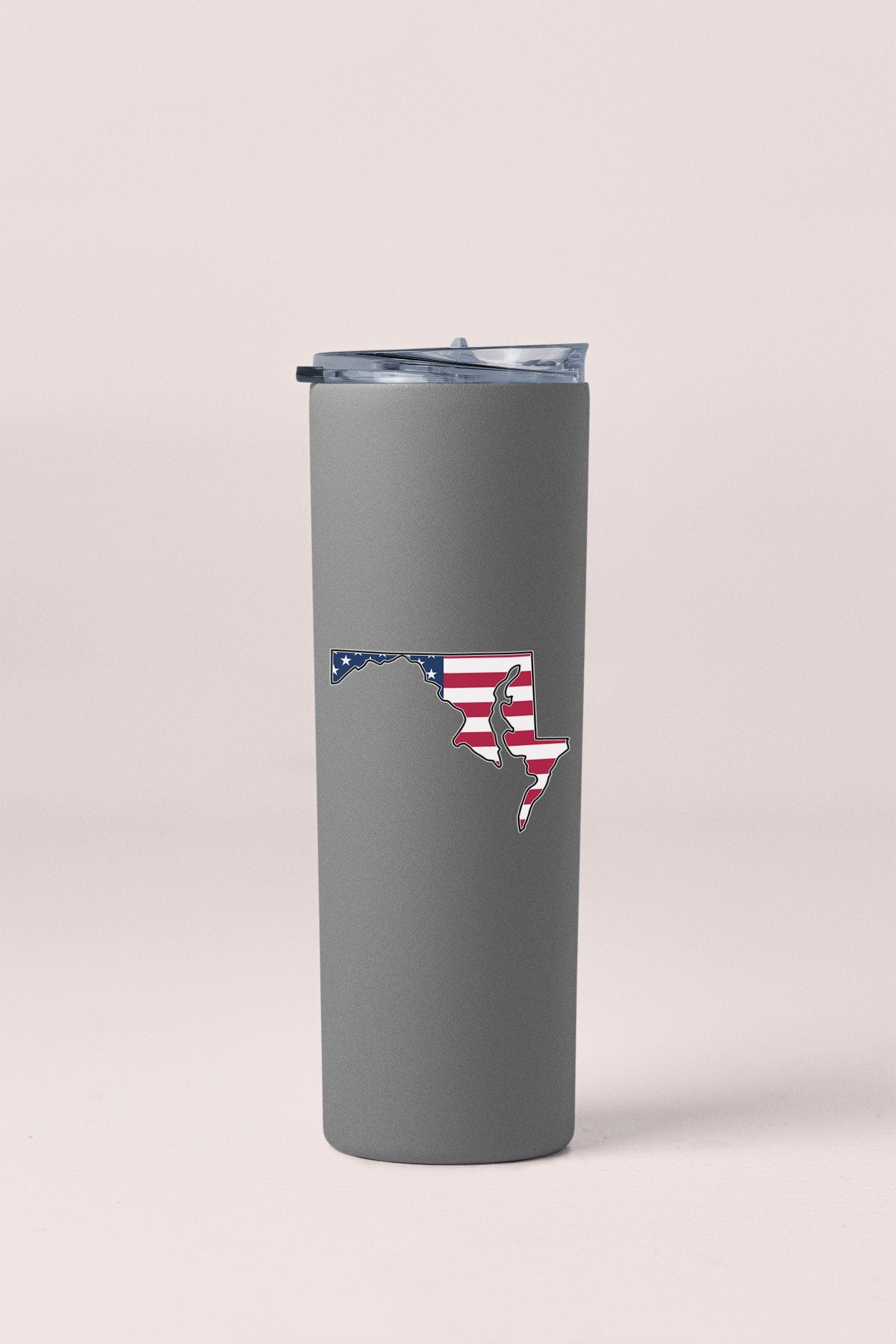 a gray tumbler cup with the state of florida painted on it