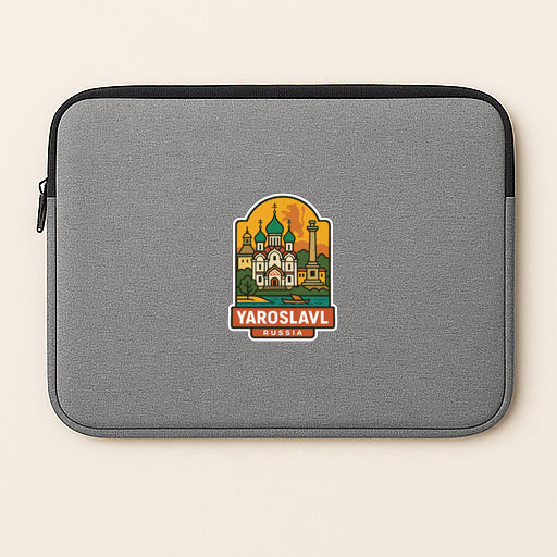 A gray laptop sleeve with a sticker depicting the Yaroslavl Cathedral in Yaroslav, Russia.