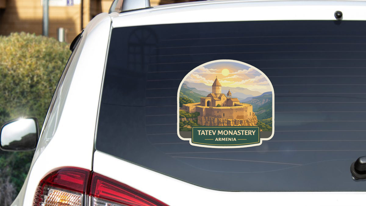 a sticker on the rear window of a car that displays a castle and mountains, with the text "TATEV MONASTERY ARMENIA".