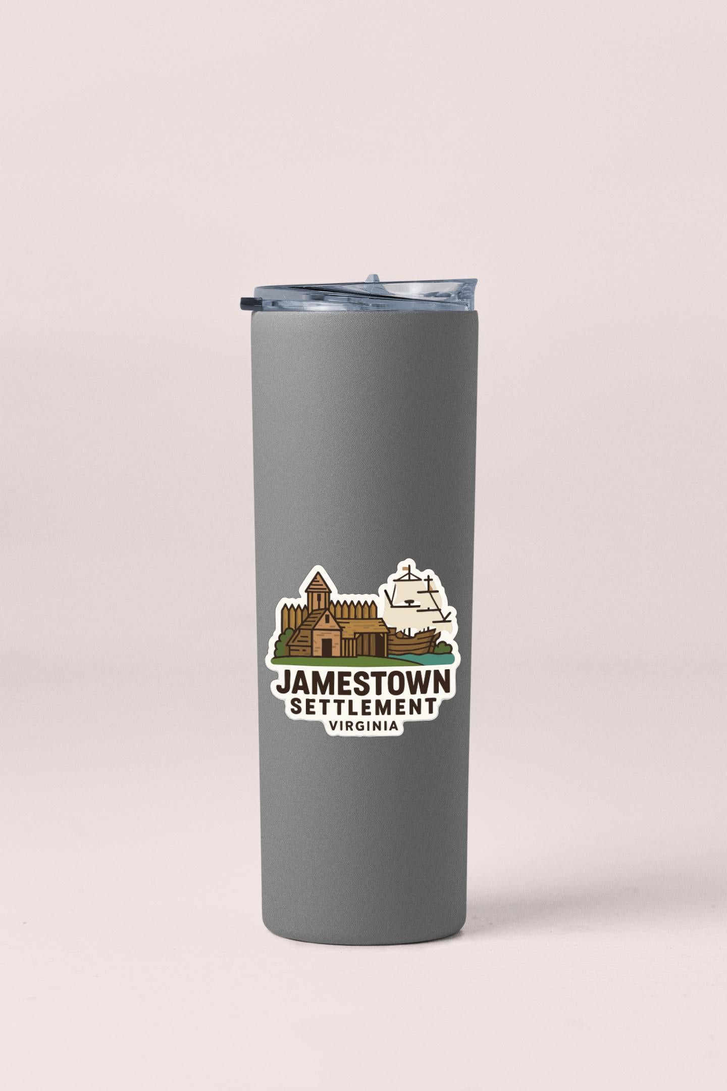 A gray insulated tumbler with a lid and a sticker featuring an illustration of Jamestown Settlement, Virginia.
