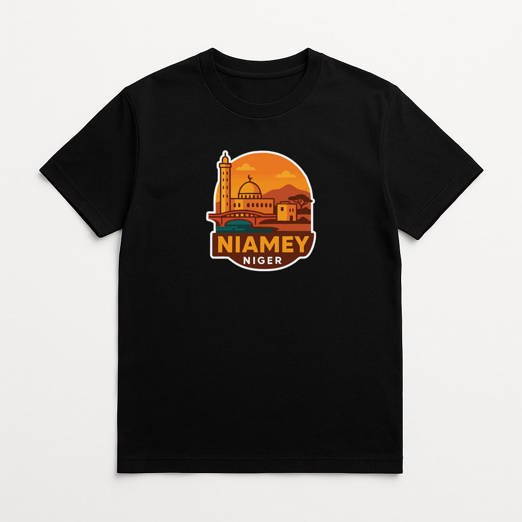 A black t-shirt with a graphic design depicting a building and a sunset.