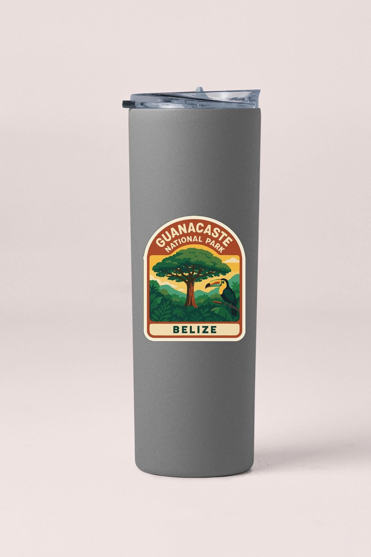 A gray tumbler with a label that says "GUANACASTE NATIONAL PARK BELIZE" on it.