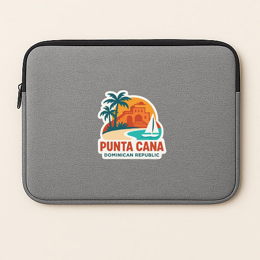 A gray laptop sleeve with a sticker depicting a tropical island scene and a sailboat.