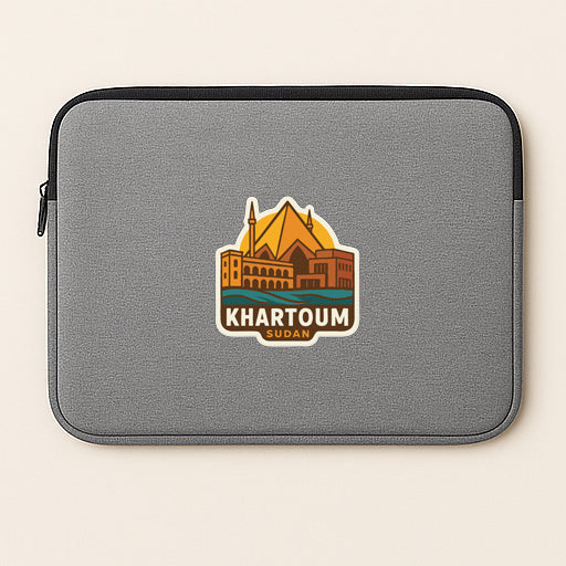 A gray laptop sleeve with a sticker of Khartoum, Sudan, printed on it.
