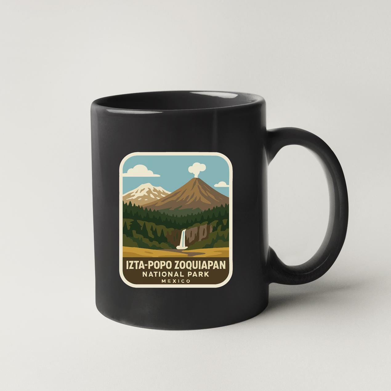 A black coffee mug with a label that says "IZTA-POPO ZOQUIPAN NATIONAL PARK MEXICO".