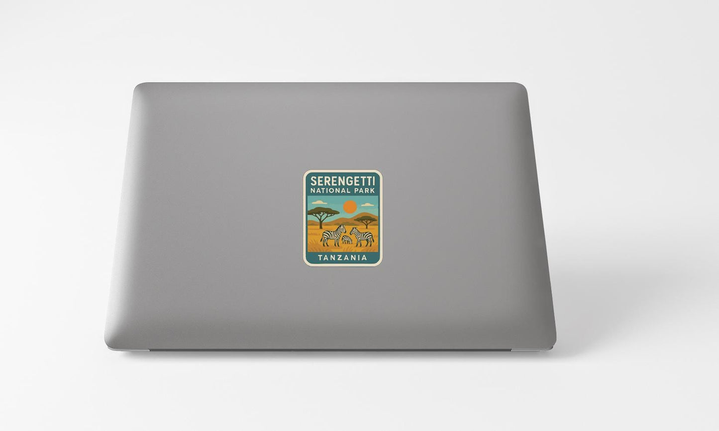 a sticker with the text "Serengeti National Park" and an illustration of a safari scene with zebras and an elephant.