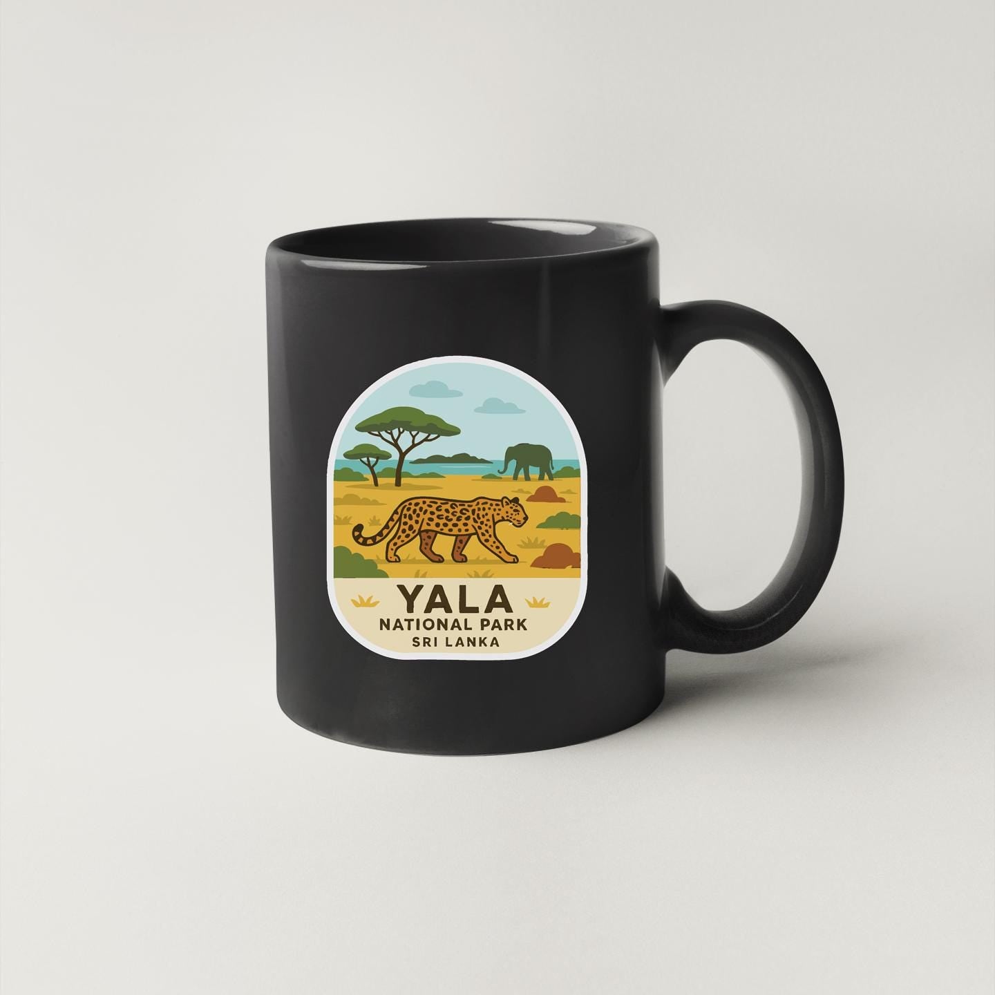 A black coffee mug with a graphic design depicting a leopard and a landscape with trees and clouds.