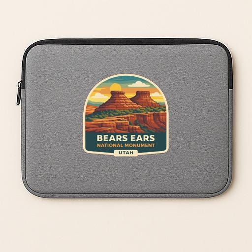 a gray laptop sleeve with a graphic design depicting the Bears Ears National Monument in Utah.
