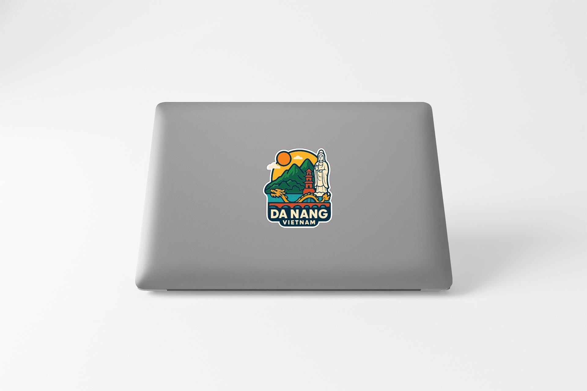 a sticker with a colorful illustration of a landmark, specifically Da Nang, Vietnam.