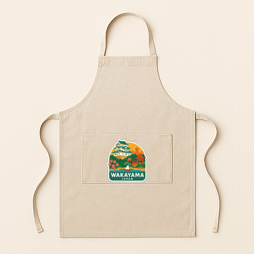 A beige apricot with a graphic of a Japanese temple and the text "Wakayama" printed on it.