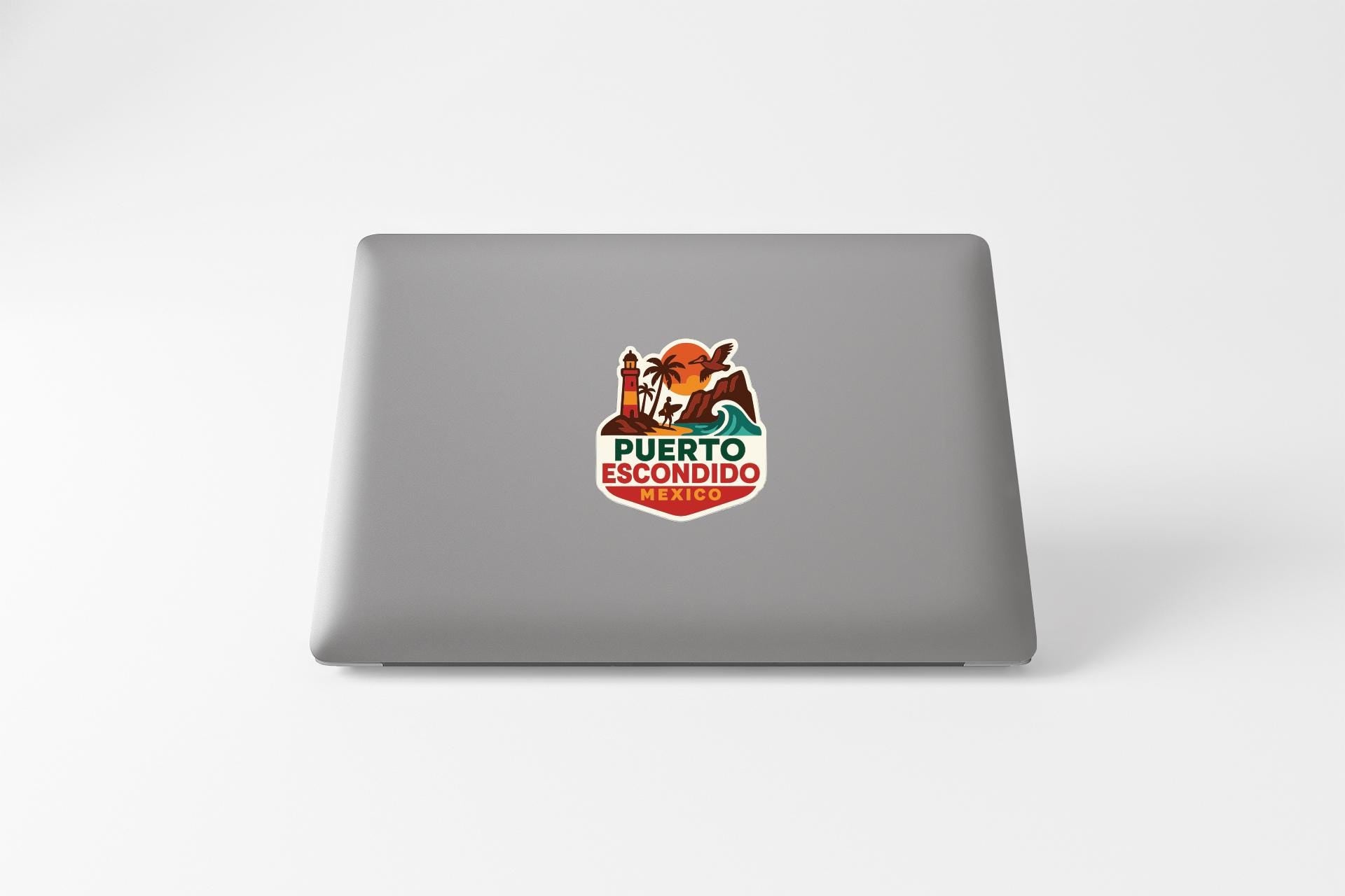 a sticker on the back of a laptop that says "Puerto Escondido".