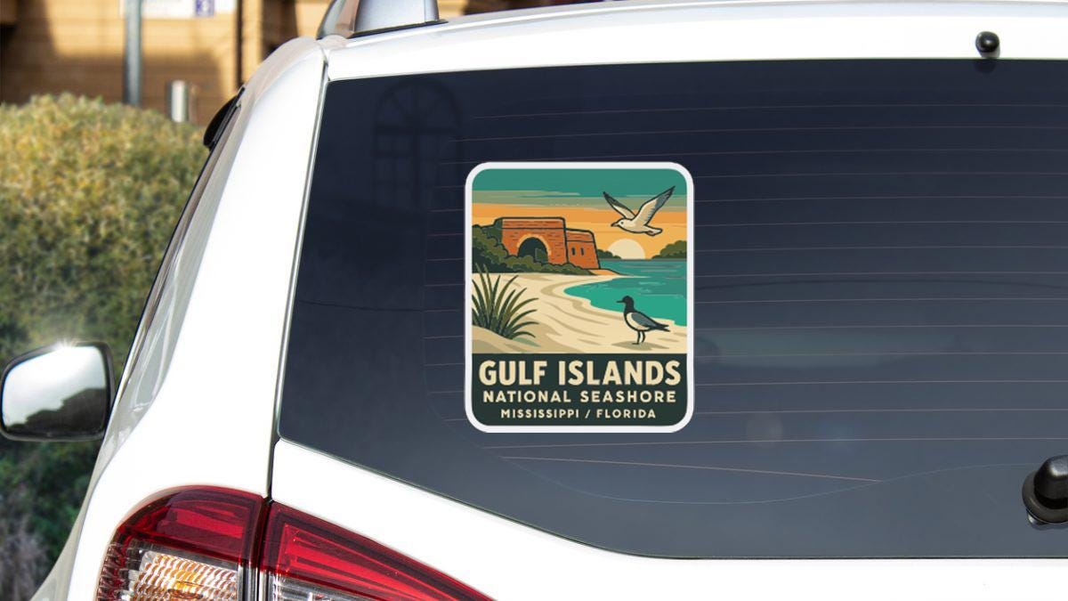 A sticker on the rear window of a car, depicting a scenic beach with palm trees and a bird, advertising the Gulf Islands National Seashore in Mississippi, Florida.