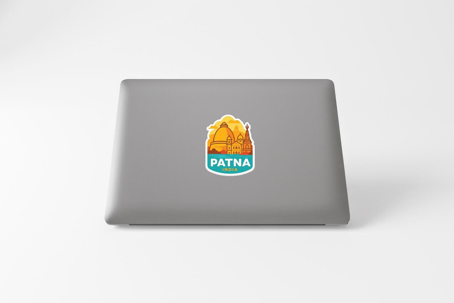 a sticker with the word "PATNA" on a laptop.