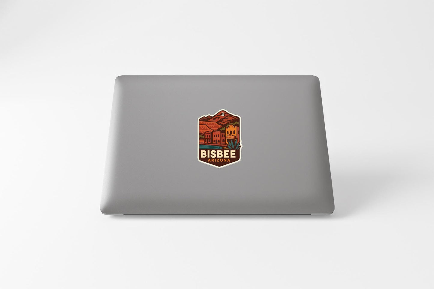 a sticker with a graphic design on the back of a laptop.