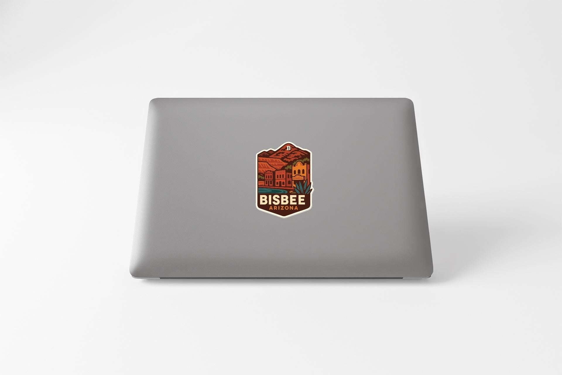 a sticker with a graphic design on the back of a laptop.