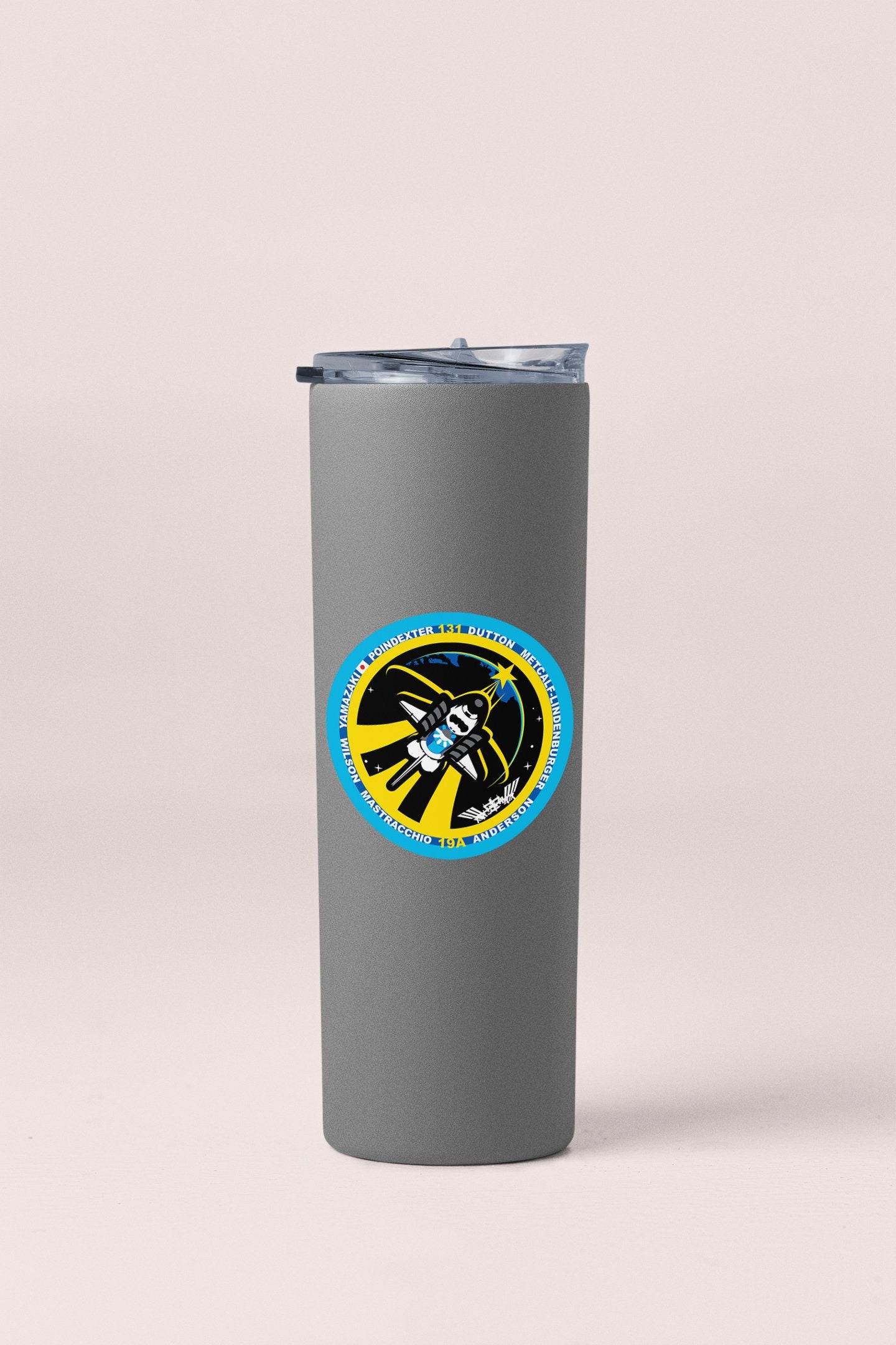 a stainless steel tumbler with a blue and yellow emblem