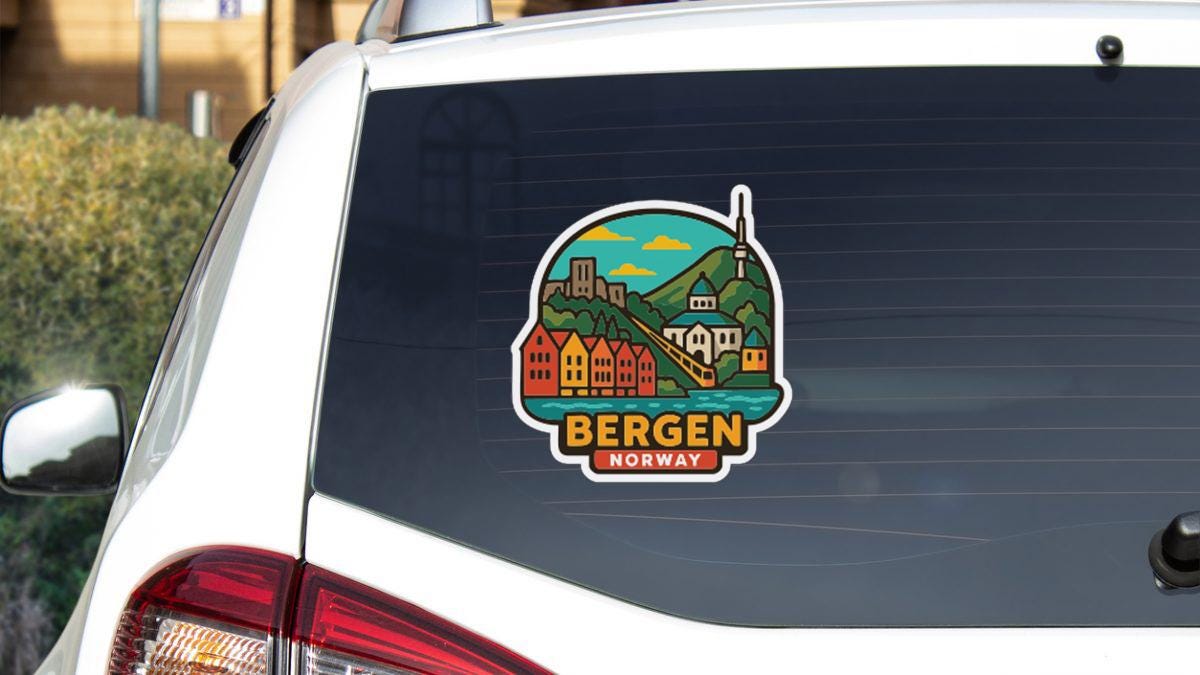 a sticker on the rear window of a car that displays a scenic view of Bergen, Norway.