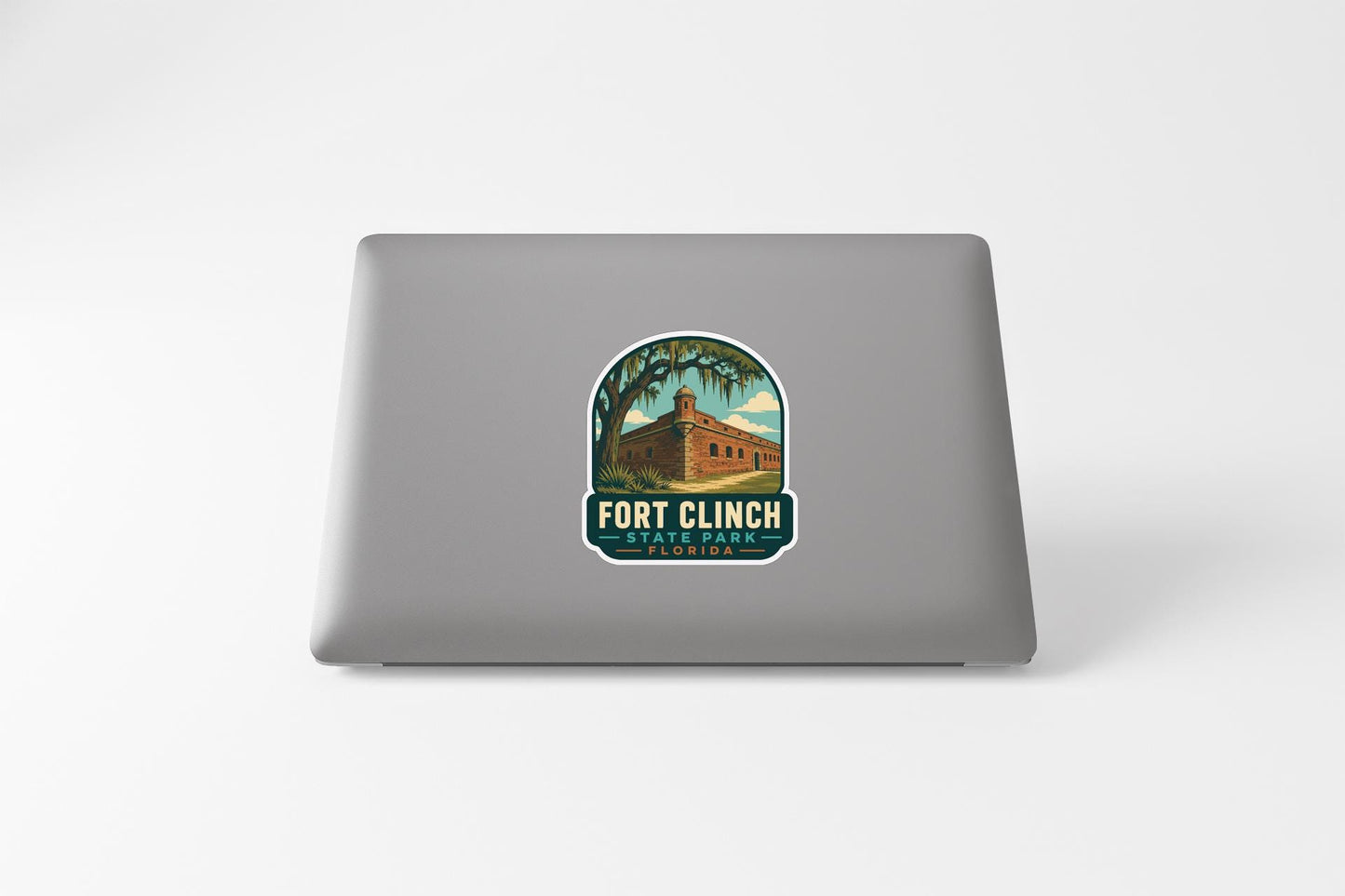 a sticker with a graphic of a building and palm trees, along with the text "FORT CLINCH STATE PARK".