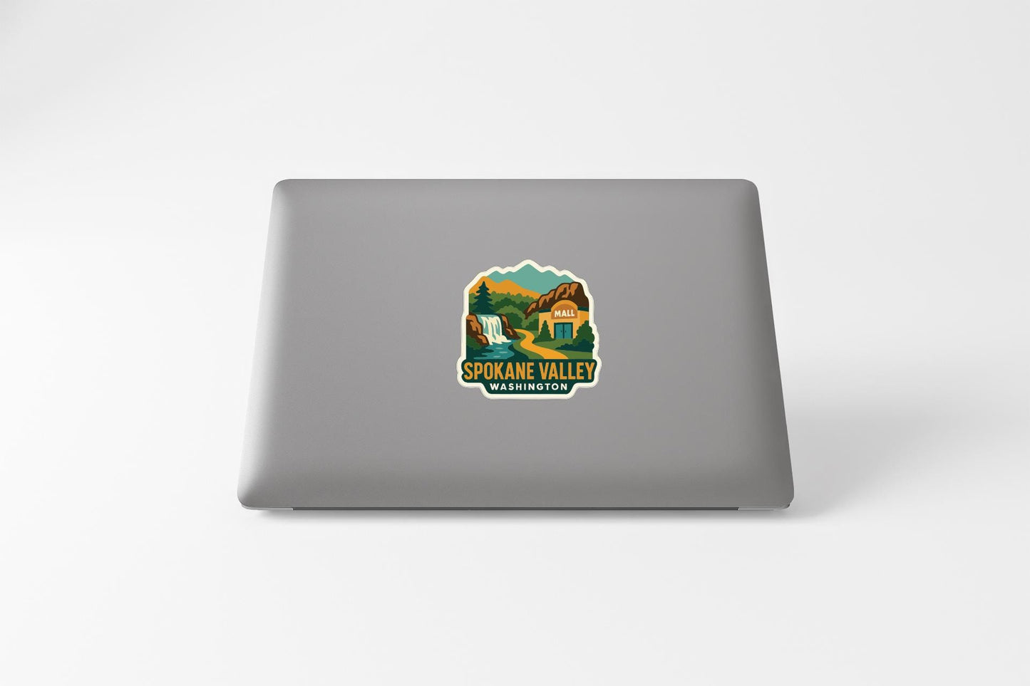 a sticker on the back of a laptop that says "SPOKANE VALLEY WASHINGTON".