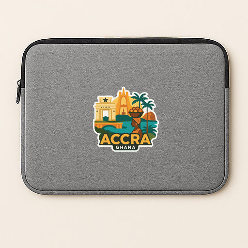 a gray laptop sleeve with a sticker depicting the Accra skyline and palm trees.