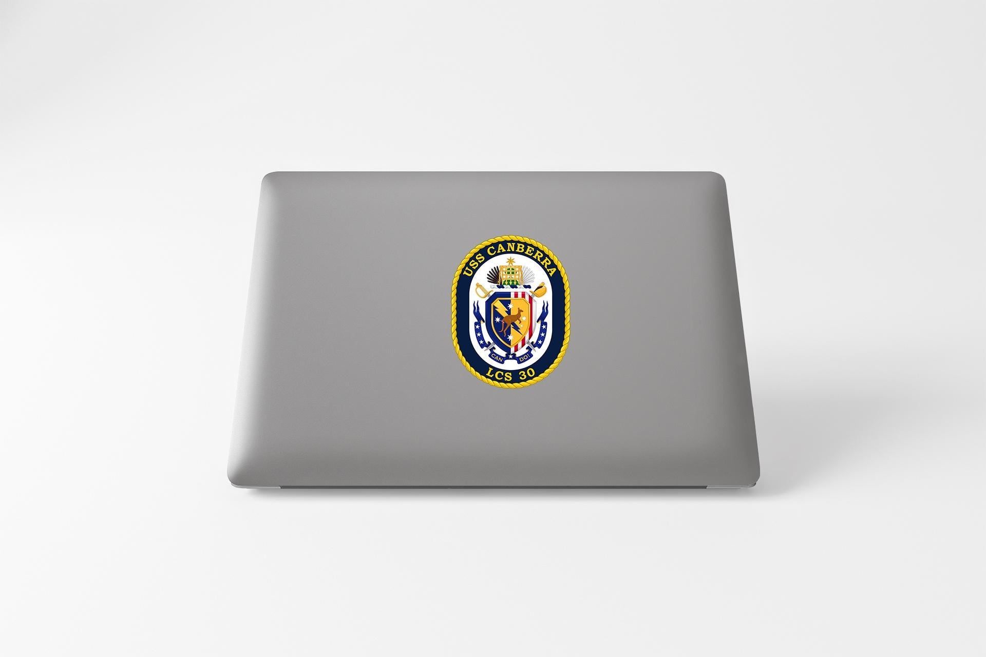 a laptop computer with a state seal on it