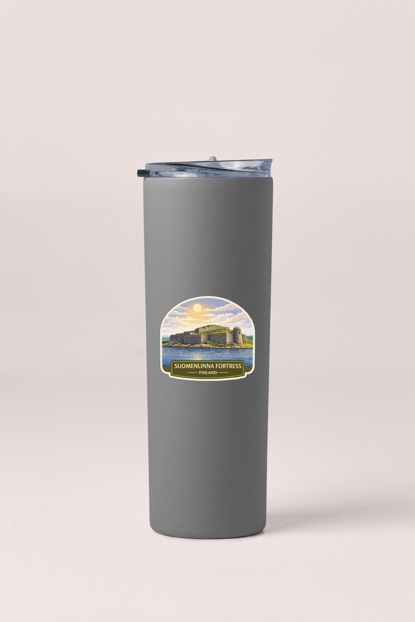 A gray insulated tumbler with a label that says "SÖLGENNA FORTREBS, FINLAND".