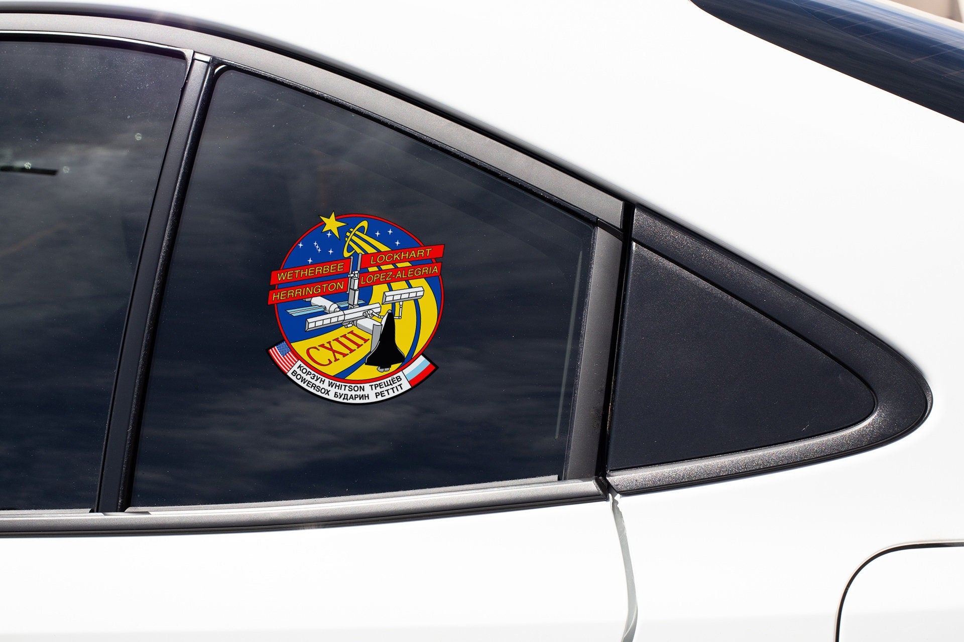 a close up of a car window with a sticker on it