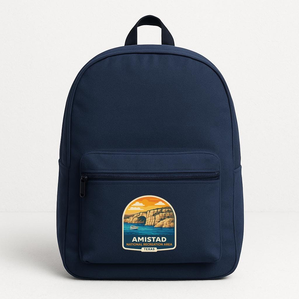 A navy blue backpack with a graphic design on the front pocket, depicting a scenic landscape with mountains and a body of water.
