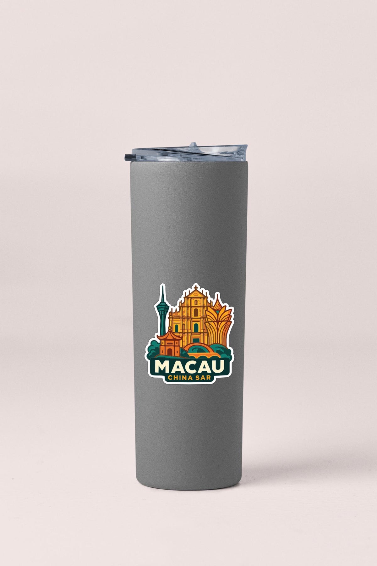 A gray insulated tumbler with a sticker depicting the Macau skyline.