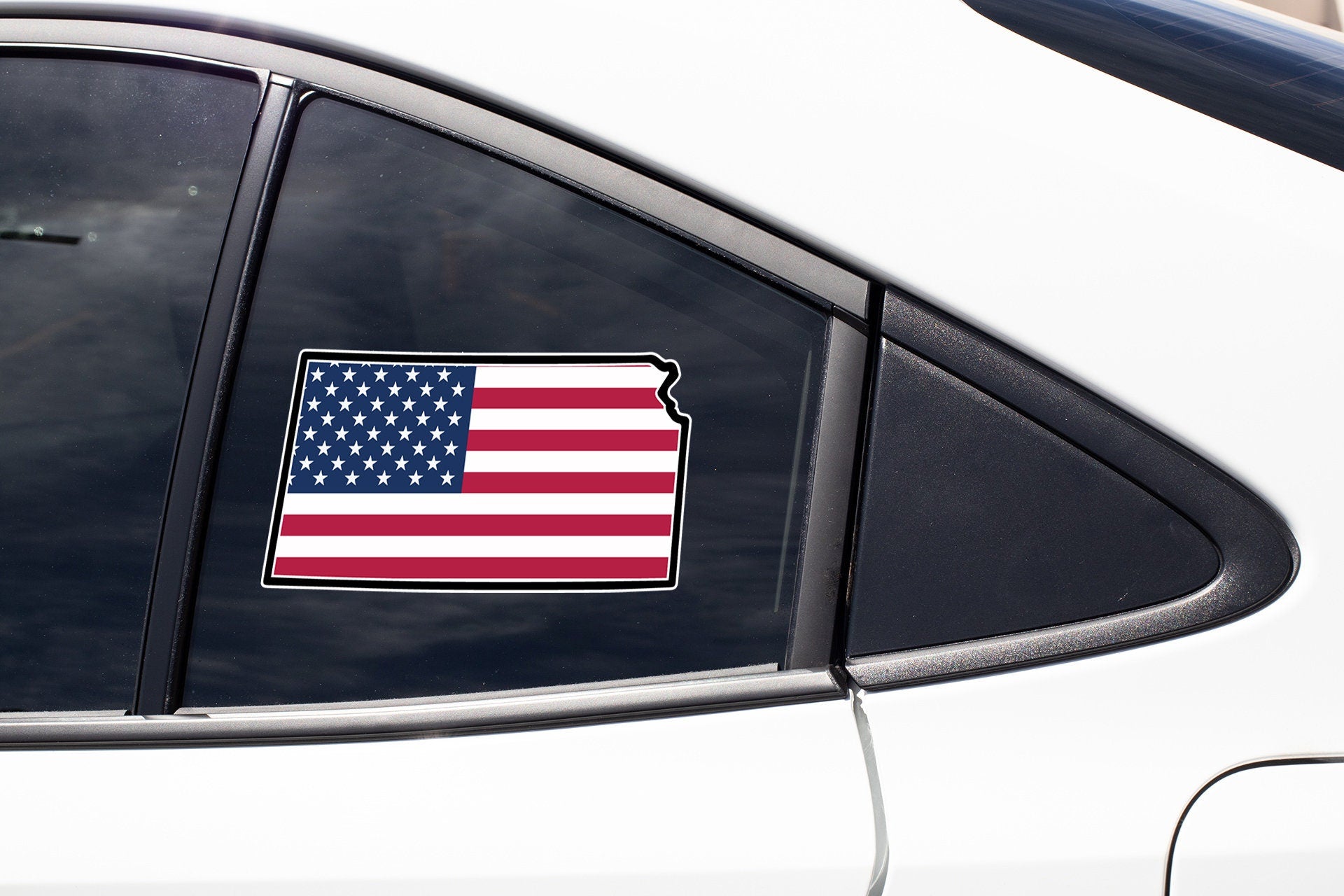 an american flag sticker on the side of a car