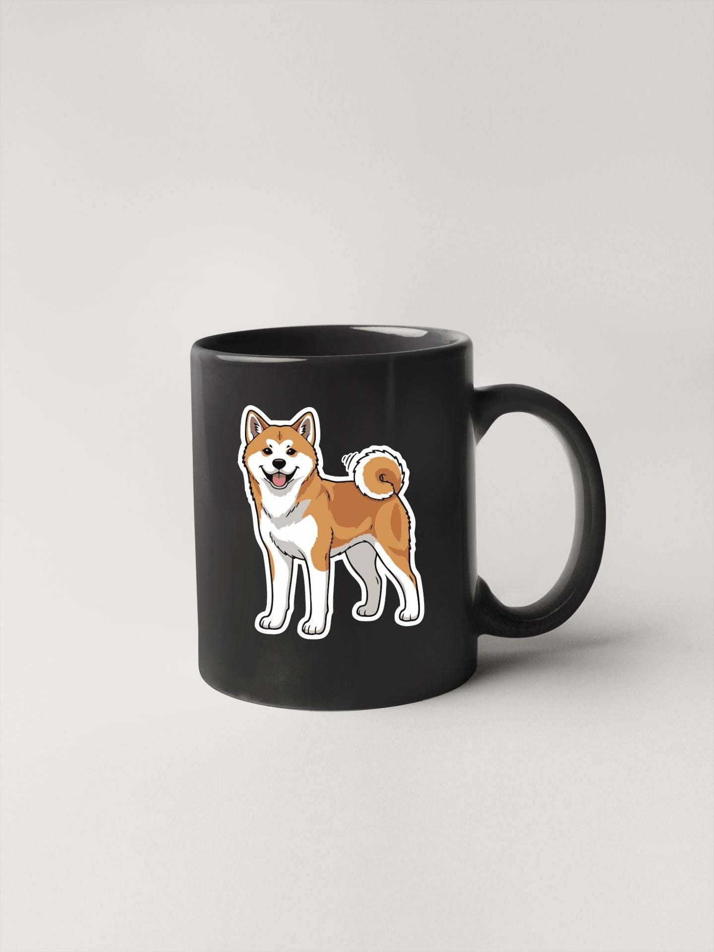 A black mug with a cartoon illustration of a Shiba Inu dog on it.
