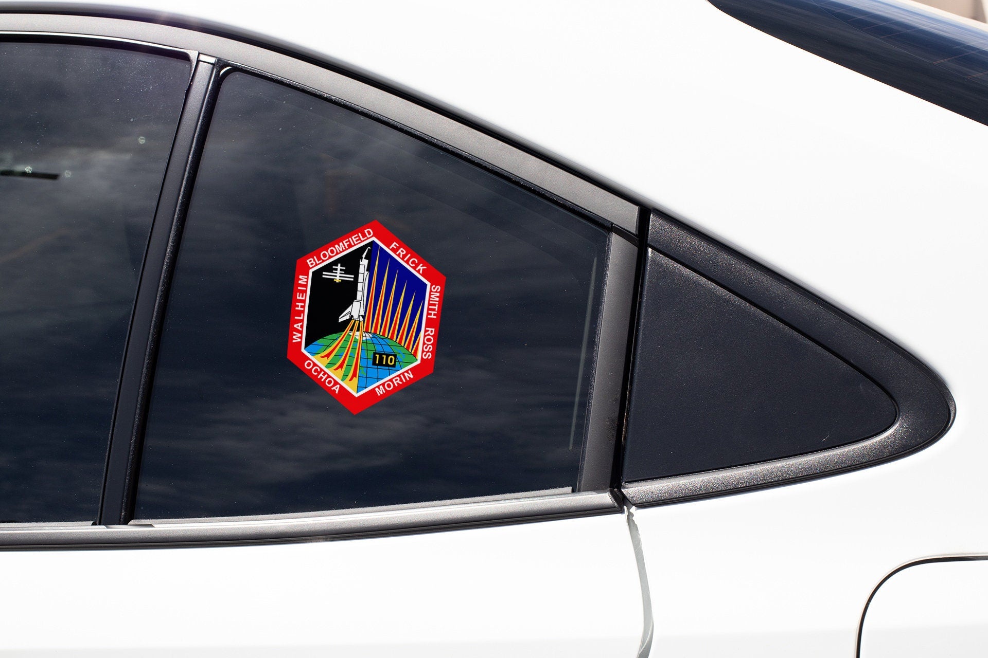 a sticker on the side of a white car