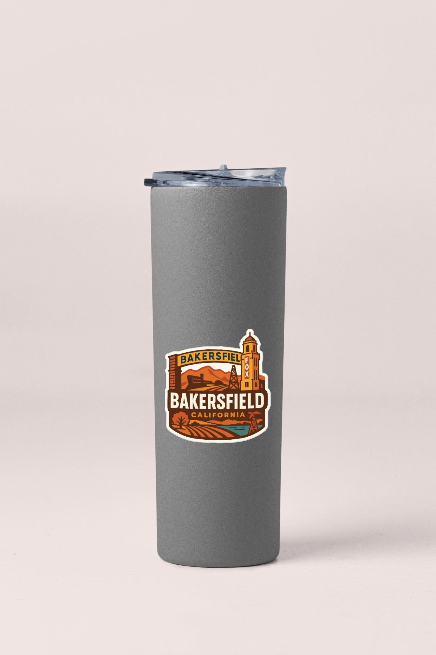 A gray insulated tumbler with a sticker that says "Bakersfield, California".