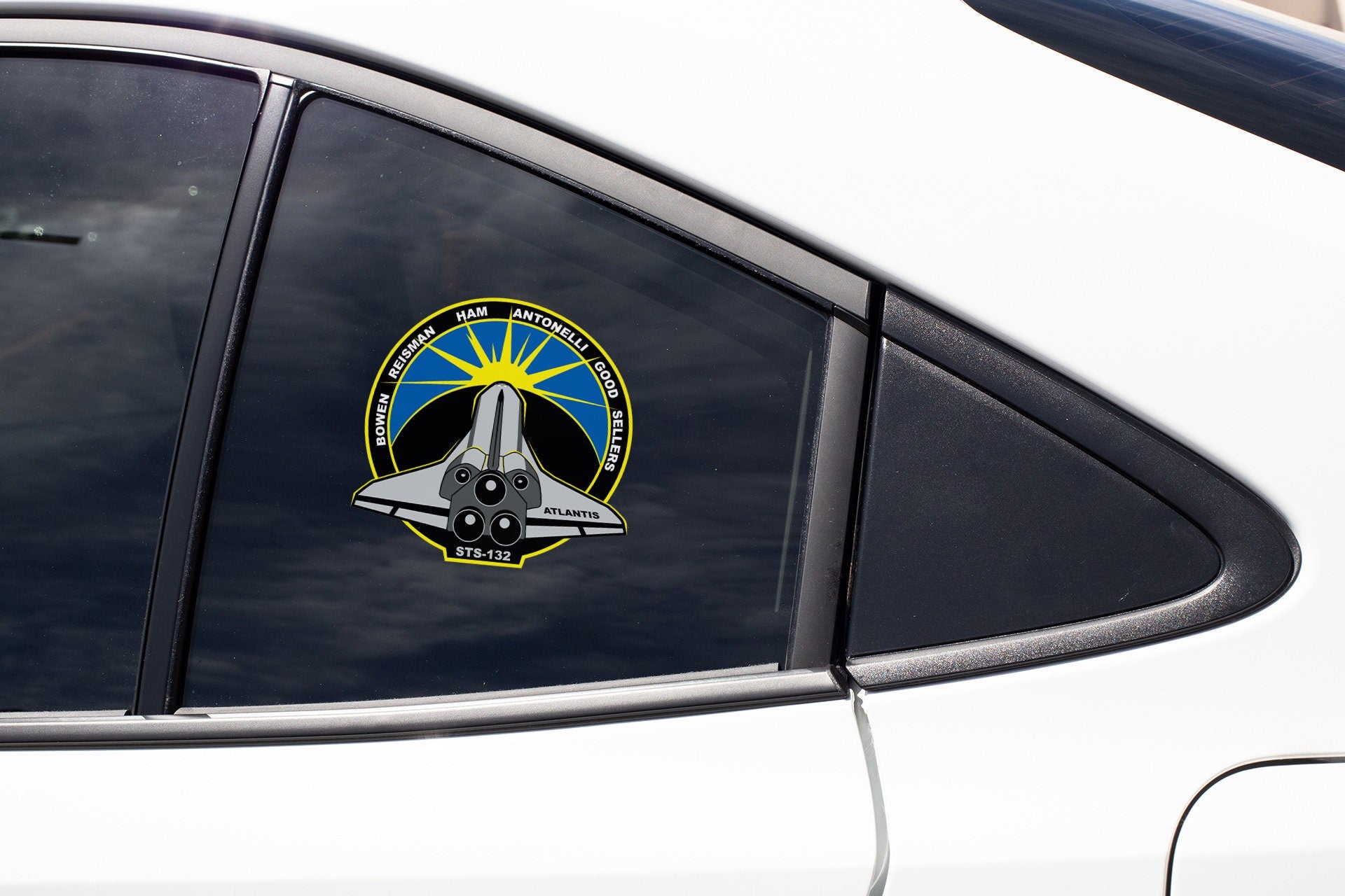 a close up of a car window with a sticker on it