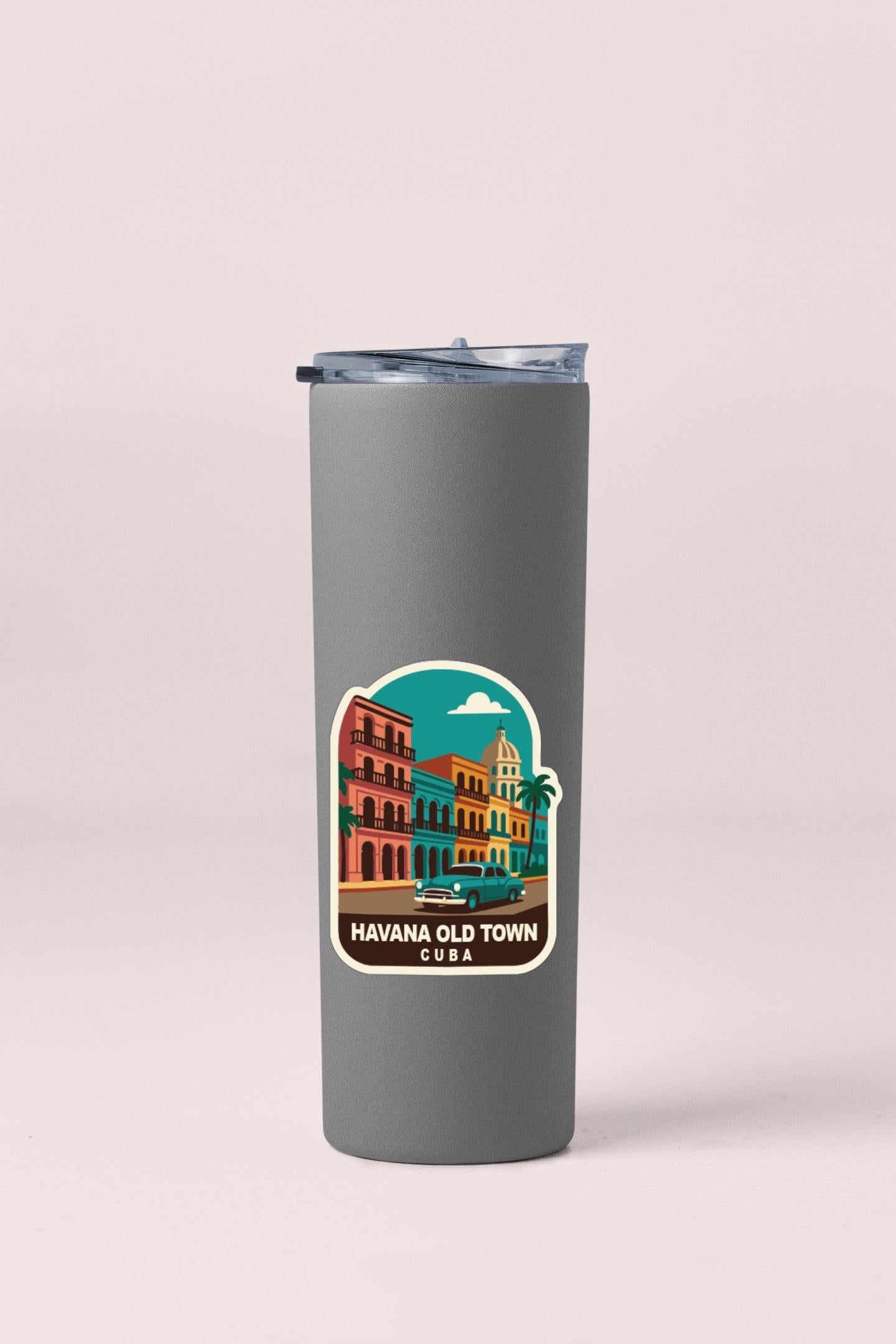 A gray insulated tumbler with a sticker depicting a colorful illustration of Havana, Cuba.