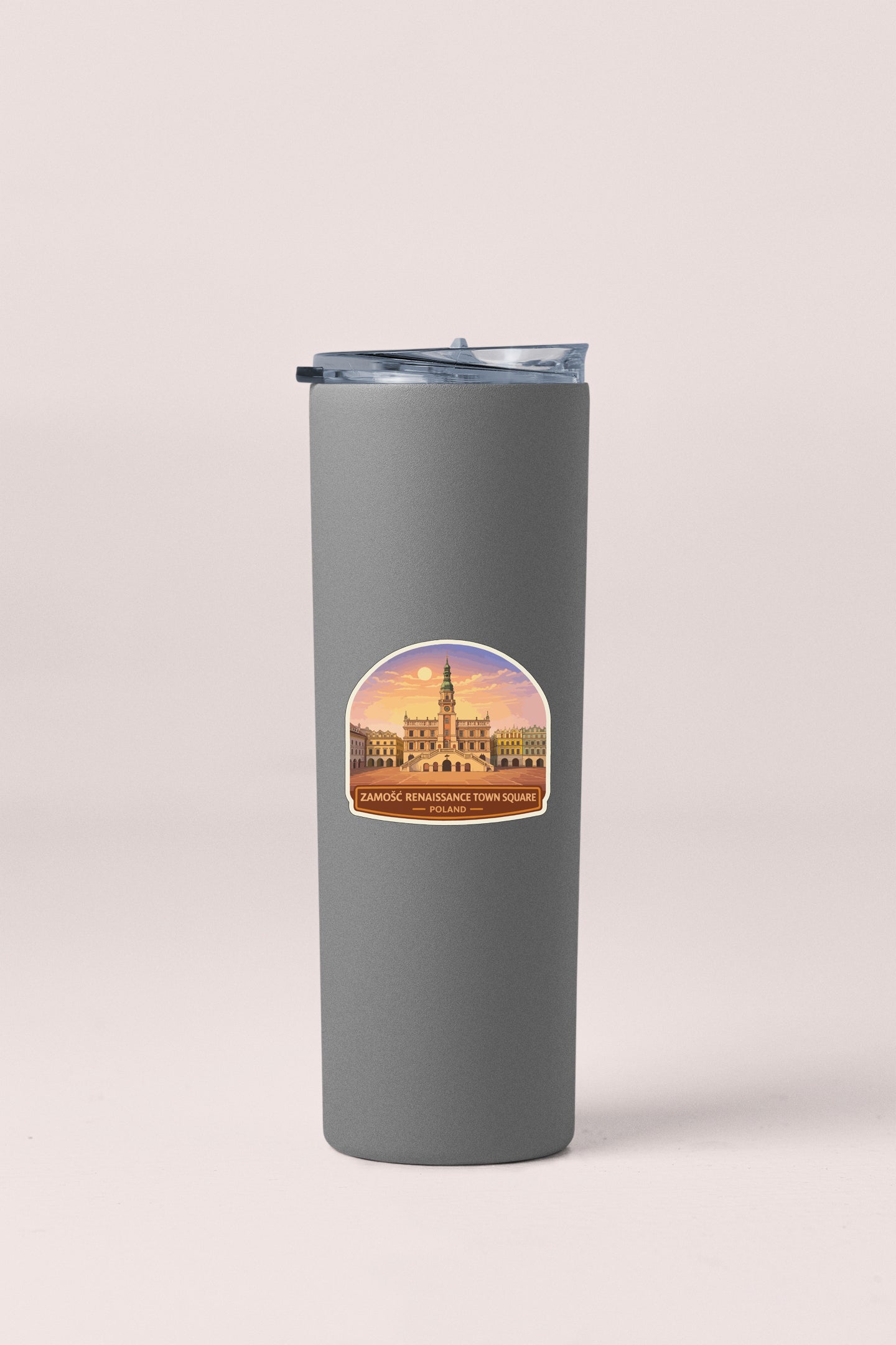 A gray cylindrical container with a sticker depicting a building and a sunset.