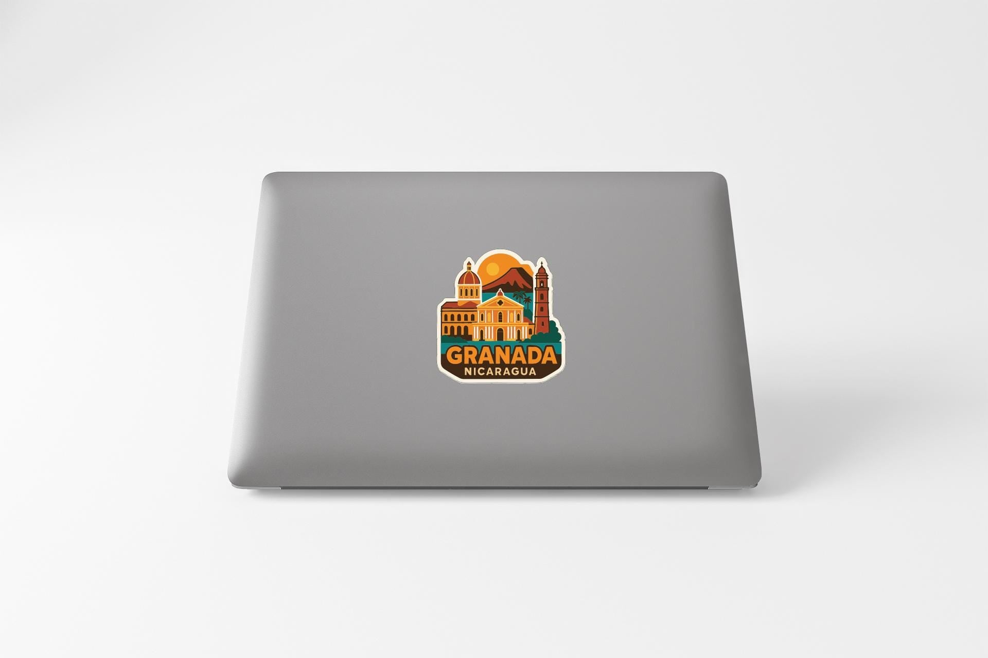 a sticker or decal of Granada, Nicaragua, on the back of a laptop computer.