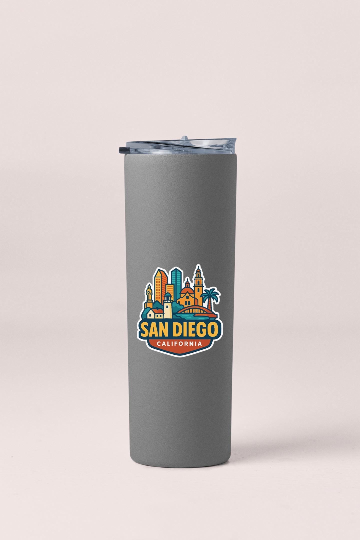 a stainless steel tumbler with a san diego skyline on it