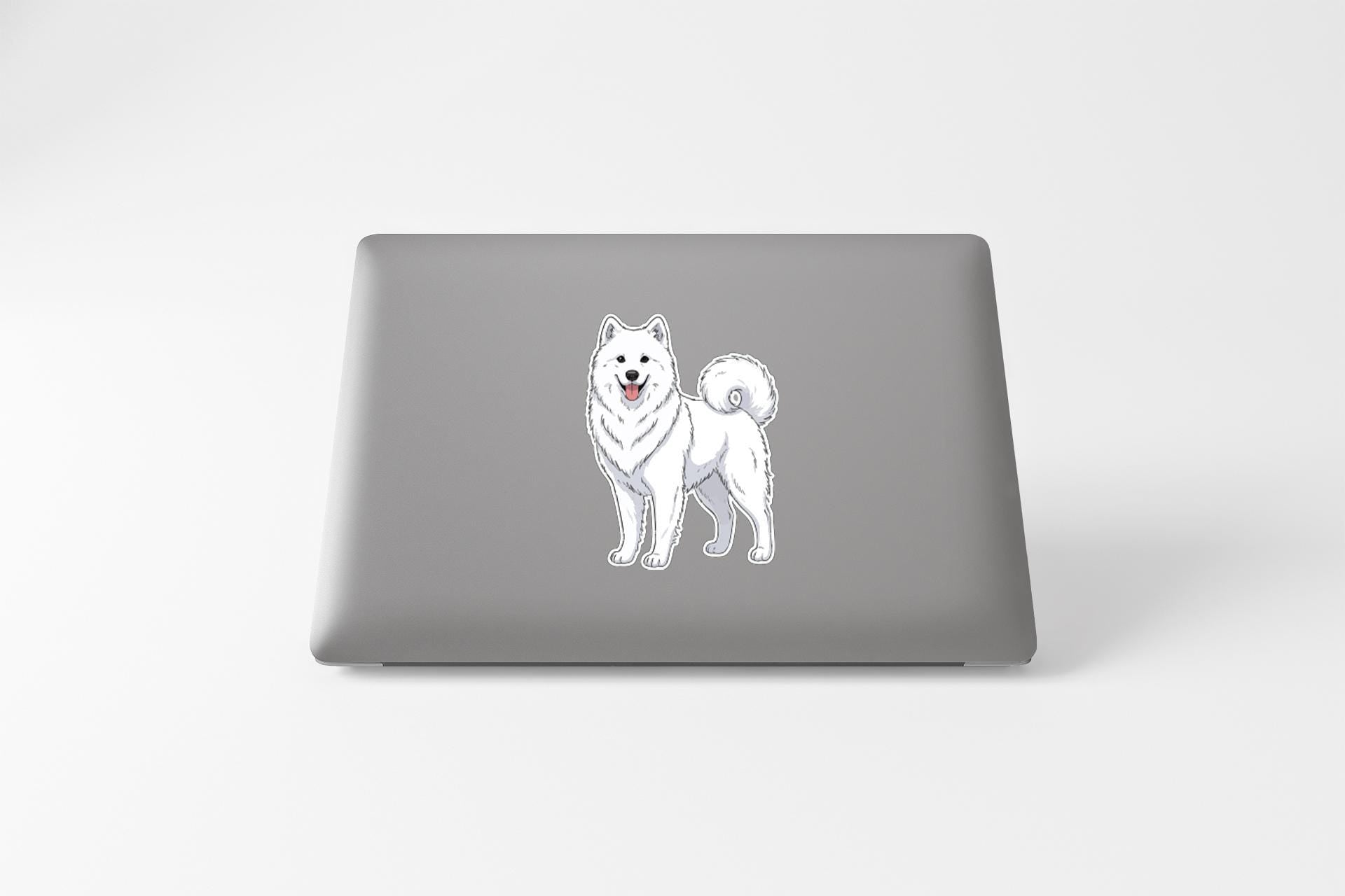 A sticker of a white Samoyed dog on the back of a laptop computer.