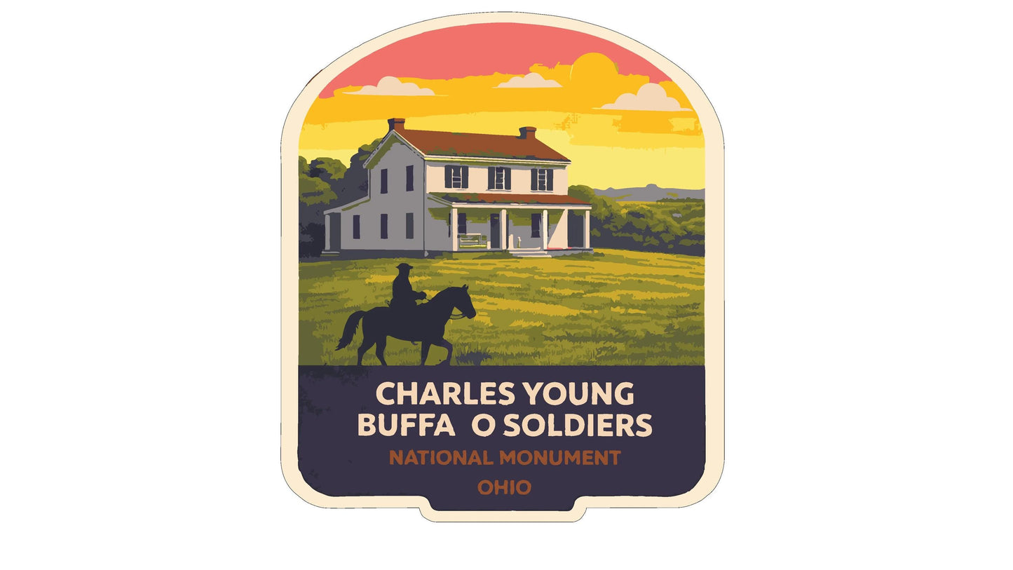 a person riding a horse in front of a house, with a sunset in the background.