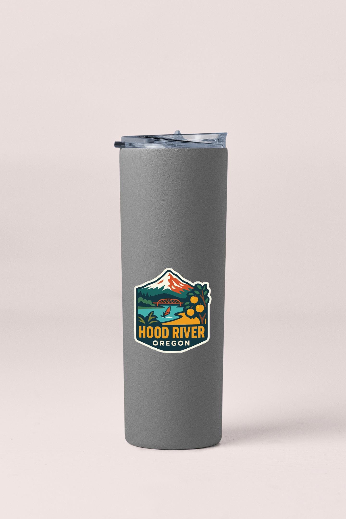A gray insulated tumbler with a logo that says "HOOD RIVER OREGON".