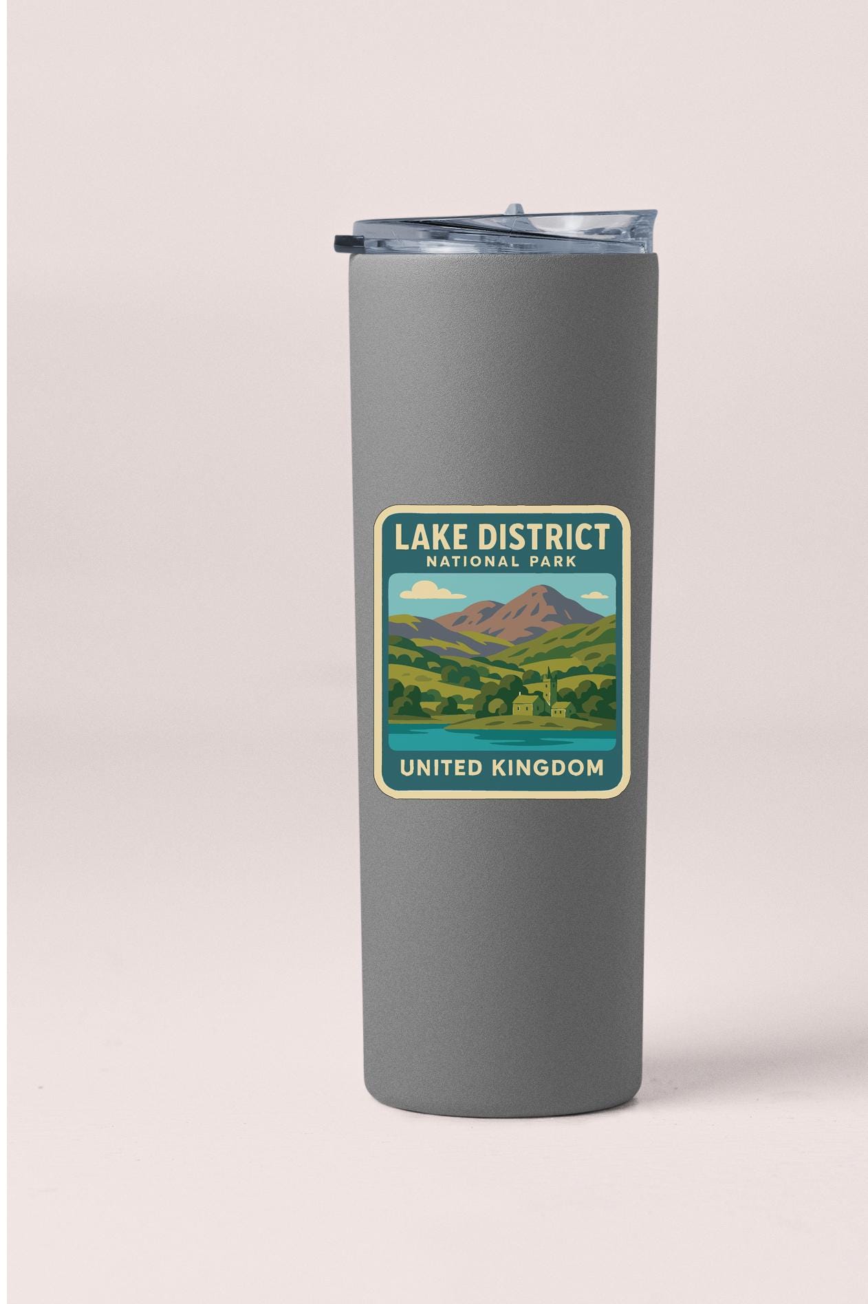 A gray insulated tumbler with a label that reads "LAKED DISTRICT NATIONAL PARK UNITED KINGDOM".