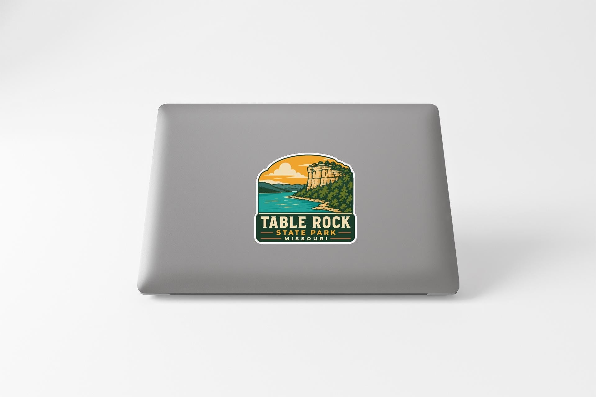 A sticker on the back of a laptop that says "TABLE ROCK STATE PARK MISSOURI".