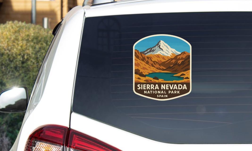 a sticker on the rear window of a car that says "Sierra Nevada National Park, Spain".