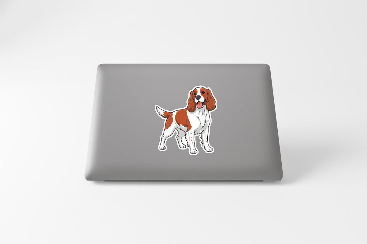 a sticker of a dog on the back of a laptop.