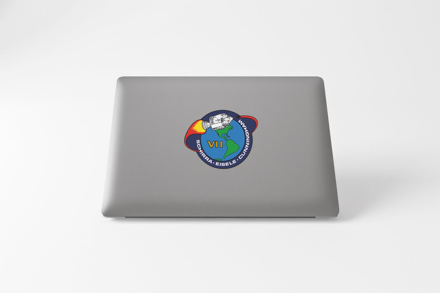 a laptop with a sticker of a cartoon character on it